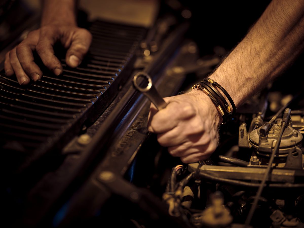 Mechanic using a wrench during car maintenance