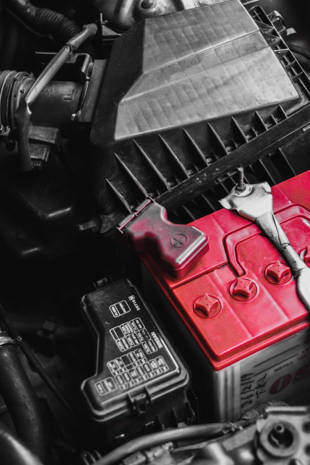 Close-up of a car battery in the engine bay