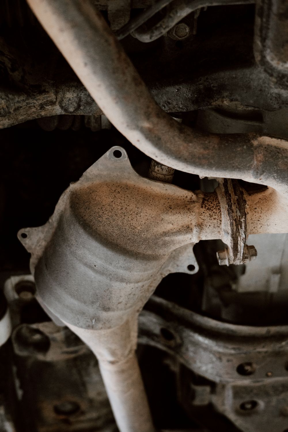 Close-up of a car exhaust and catalytic converter